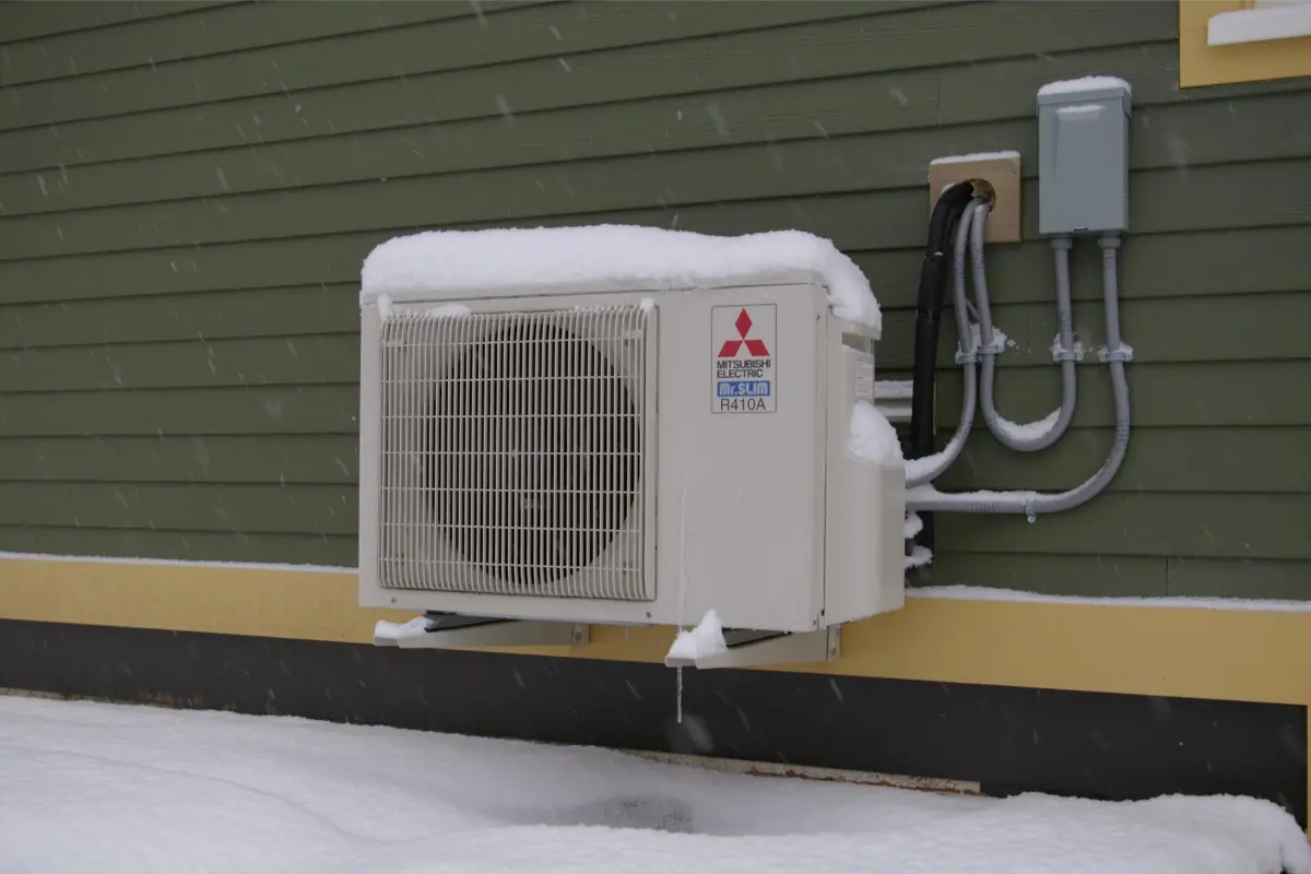 Mitsubishi cold-climate heat pump operating in snowy conditions